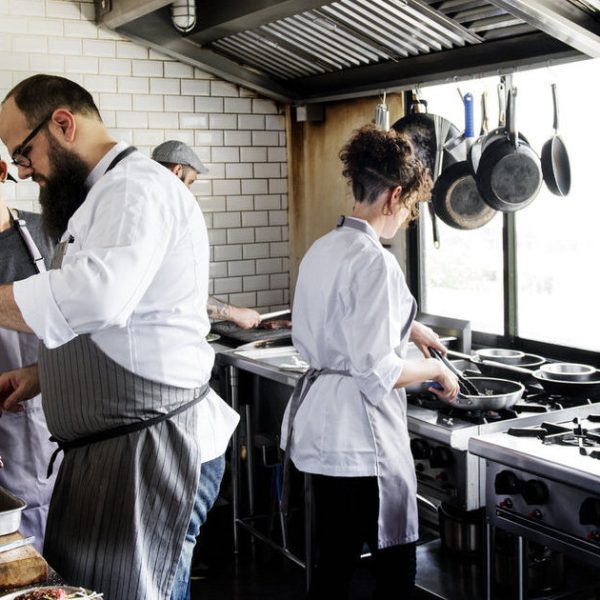 Group of chefs working in the kitchen