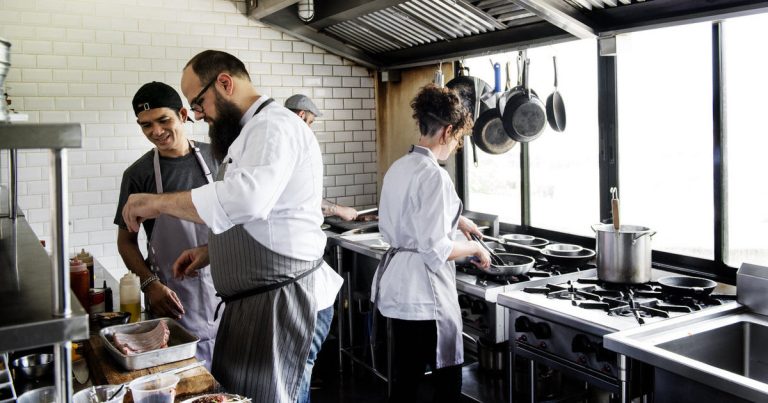 Group of chefs working in the kitchen